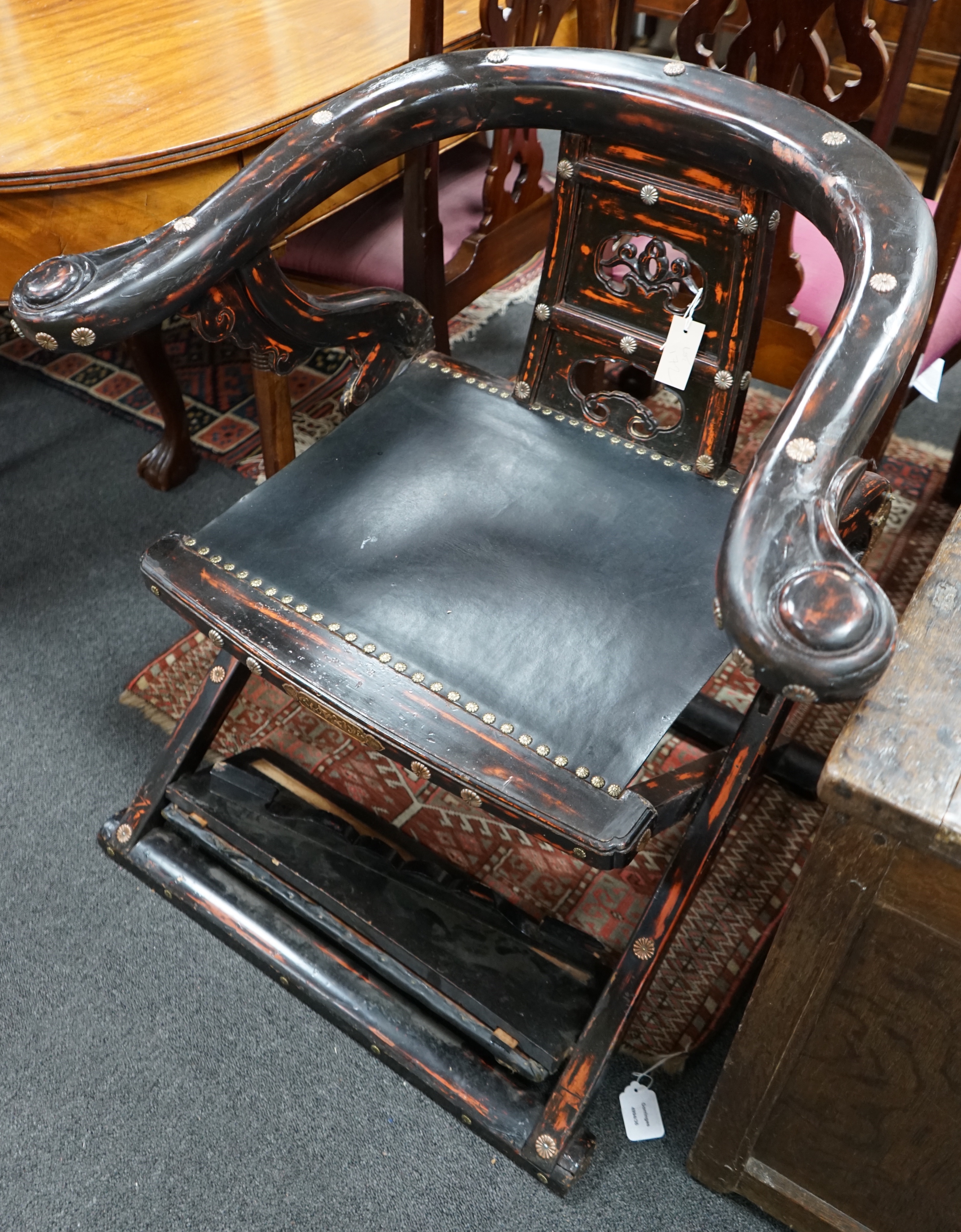 A Japanese lacquered wood hunting chair